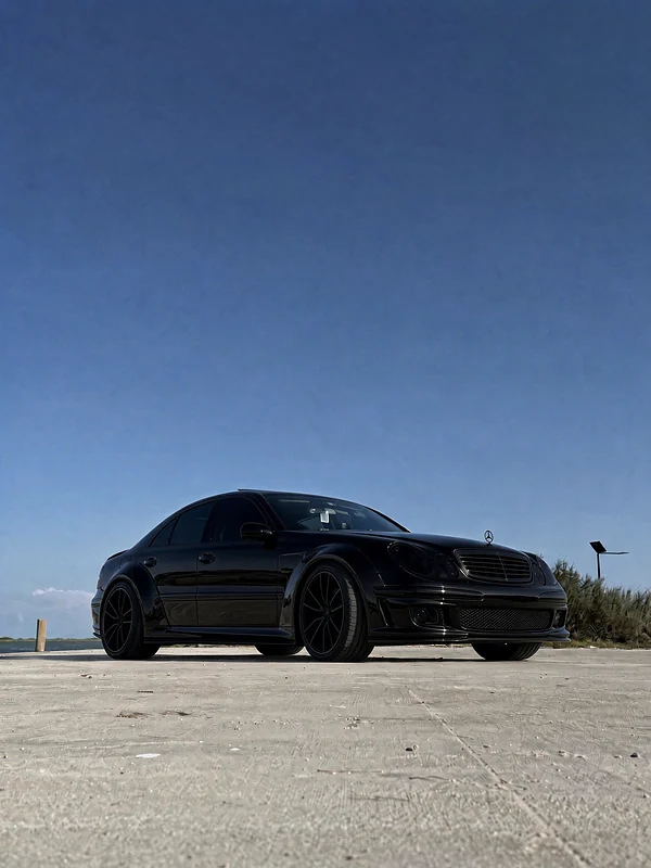 Black W211 E500, front three-quarter