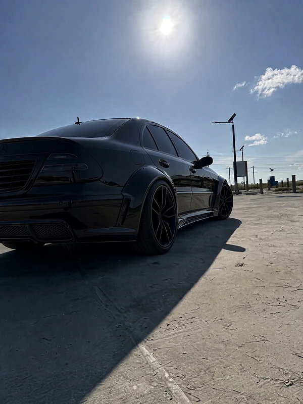 Black W211 E500, rear three-quarter